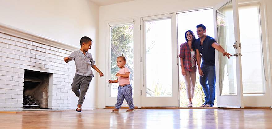 Family walking into new home