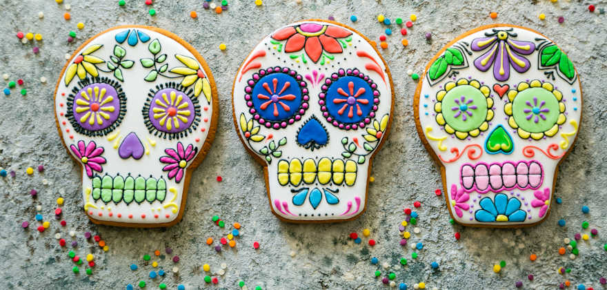 Cookies decorated like sugar skulls for Day of the Dead.