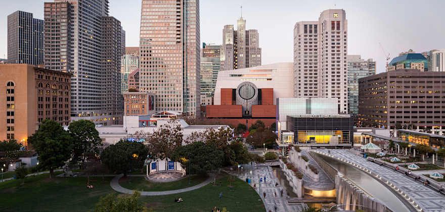 San Francisco Museum of Modern Art and Yerba Buena Gardens with San Francisco's skyline in the background.