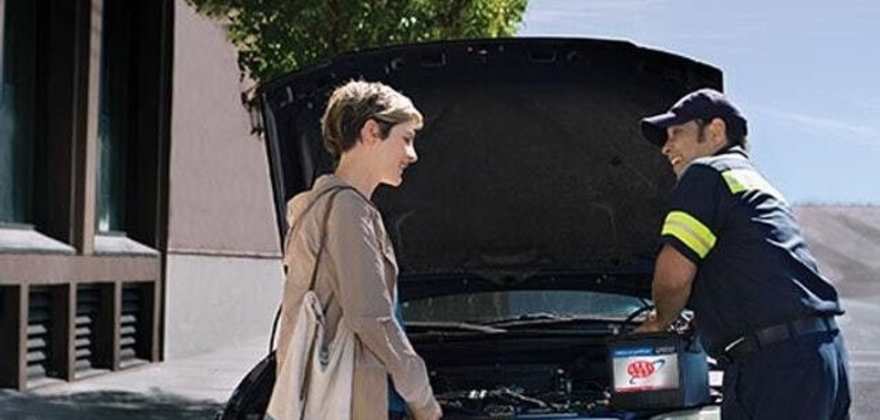 Woman getting help with car