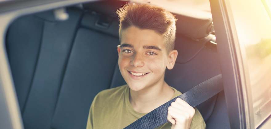 child wearing seat belt
