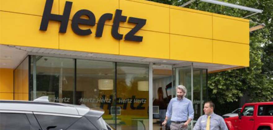 Image of someone picking up a Hertz rental