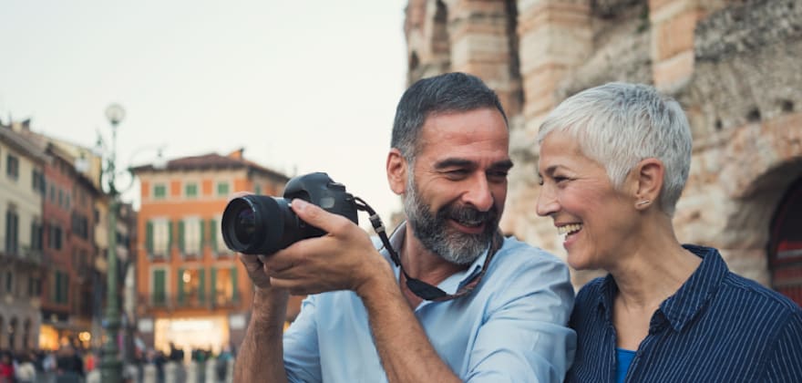 Elder couple traveling and taking pictures