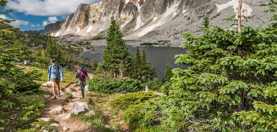 Two hikers climb a trail in the Medicine Bow Wilderness in Wyoming.