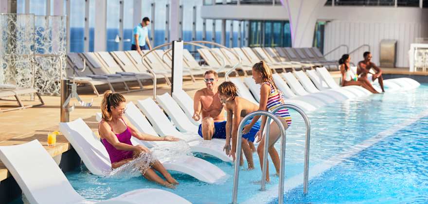 family at pool on celebrity cruise ship