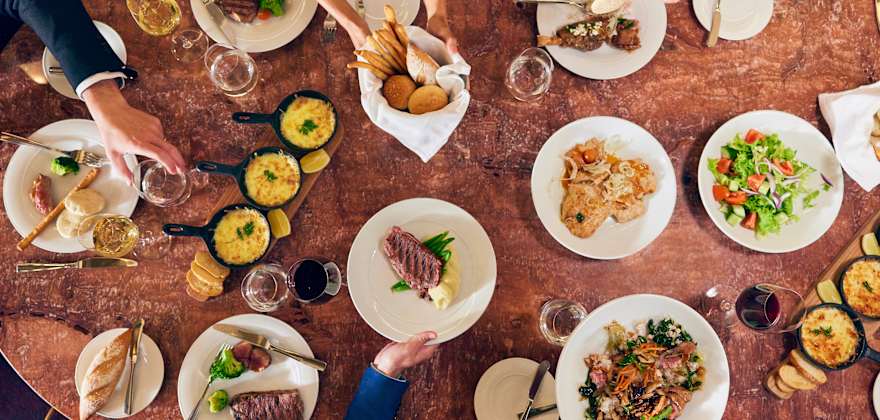 table covered with plates of food on celebrity cruise ship