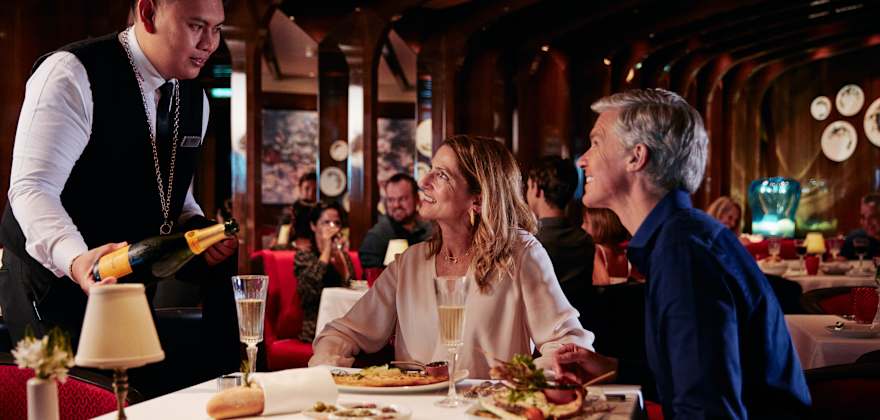 guests dining in restaurant on holland america ship