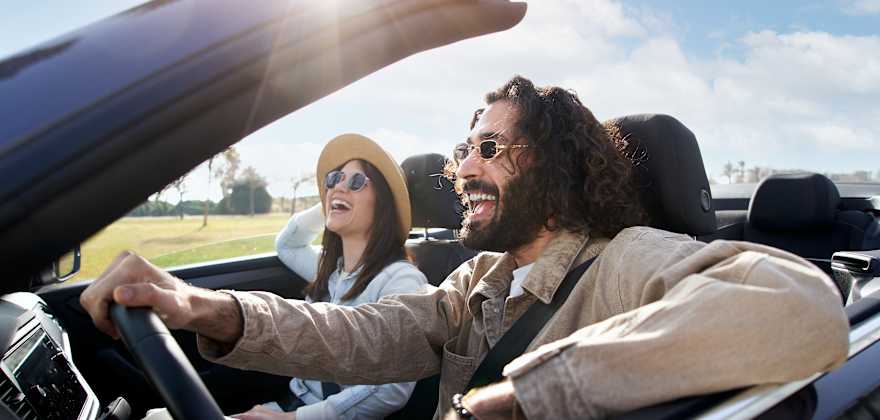 Man and woman driving car