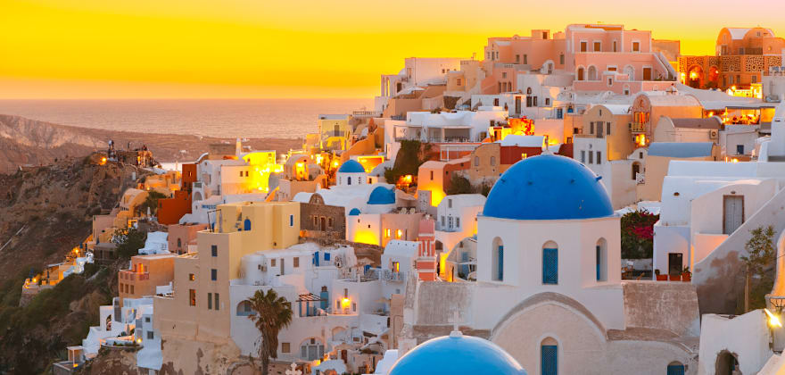 blue dome houses in santorini greece