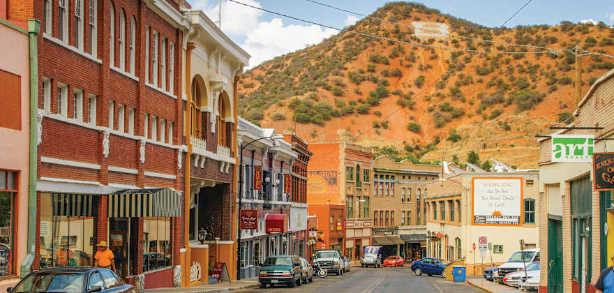 cars parked along the side of Main Steet in Bisbee, Arizona.