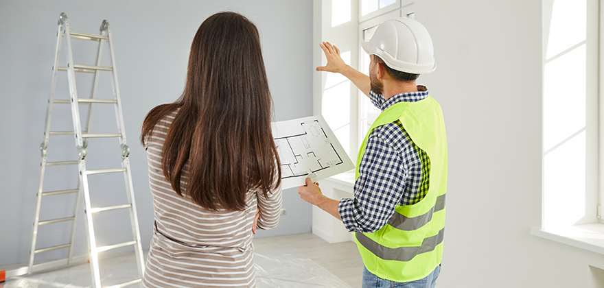 construction worker with blue prints