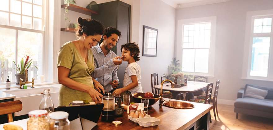 Man, woman, and child in kitchen