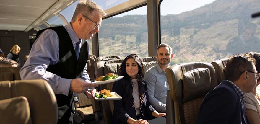 couple being served on train