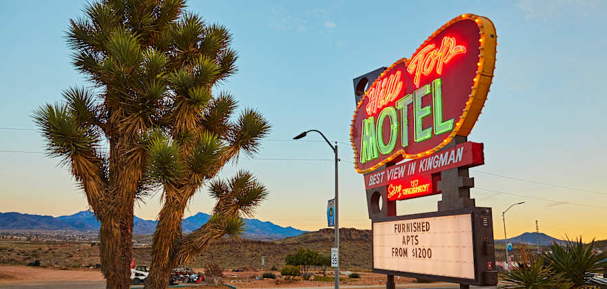 Hill Tops Motel neon sign at dusk in Kingman, Arizona, on Route 66.