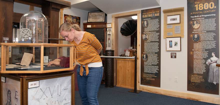 A visitor looks at an exhibit at Montana's American Computer & Robotics Museum.