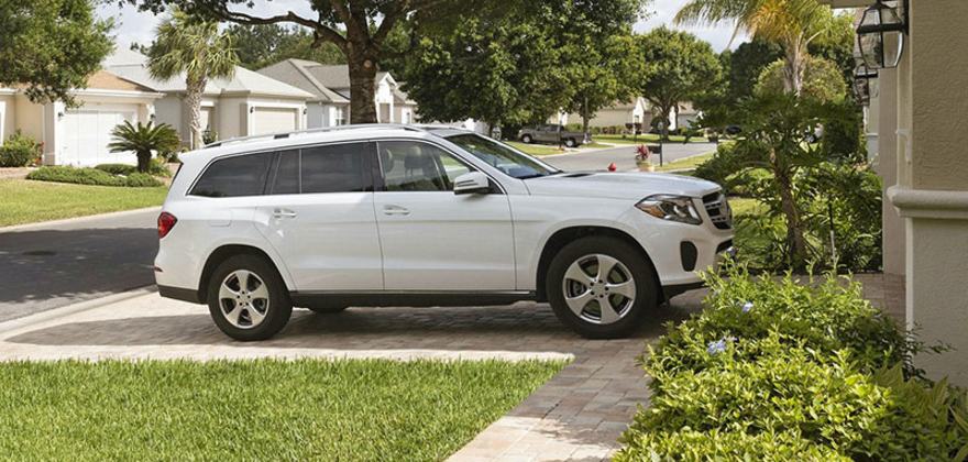 A white SUV parked in a AAA Member's driveway
