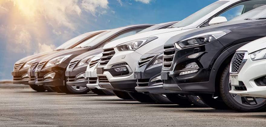 cars lined up at a dealership
