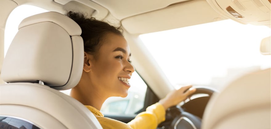 a teenager at the wheel of a car insured by AAA