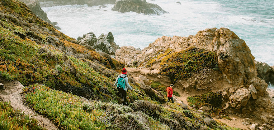 Hikers descend on path above California’s rocky Big Sur coast
