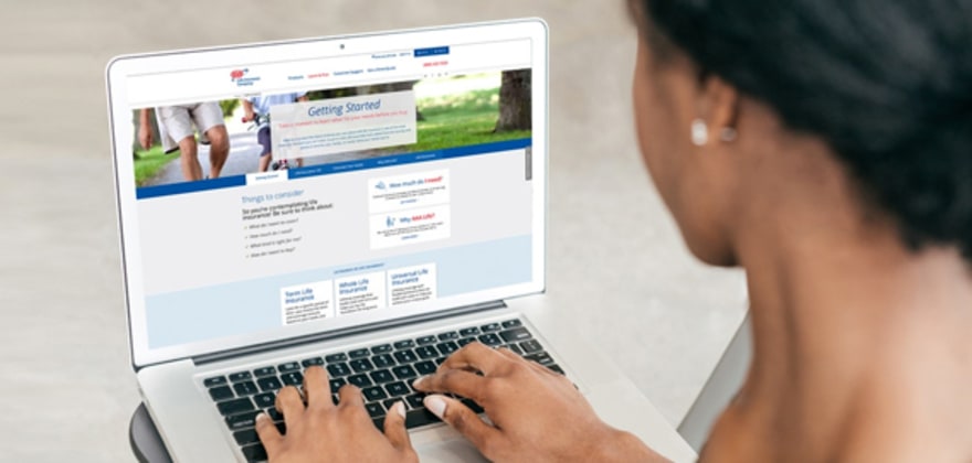 Woman researching aaa life insurance policies on her laptop