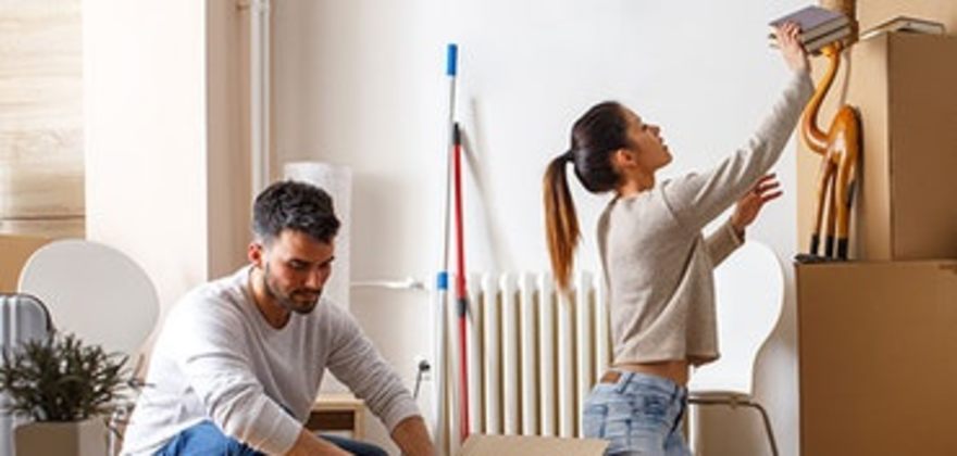 a couple with aaa renters insurance moves into their new apartment