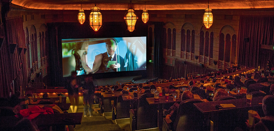 Portland's Bagdad Theater & Pub interior during movie screening.