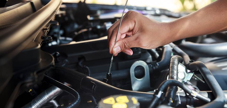 a woman's hand clutches a gearshift in a car