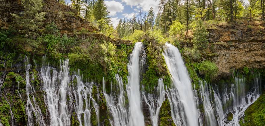 Water rushes down Burney Falls in McArthur Memorial Park, California.