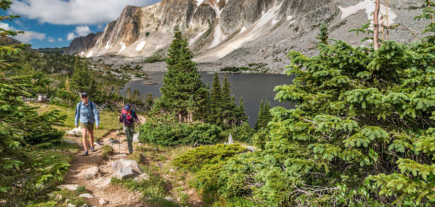 Two hikers climb a trail in the Medicine Bow Wilderness in Wyoming.