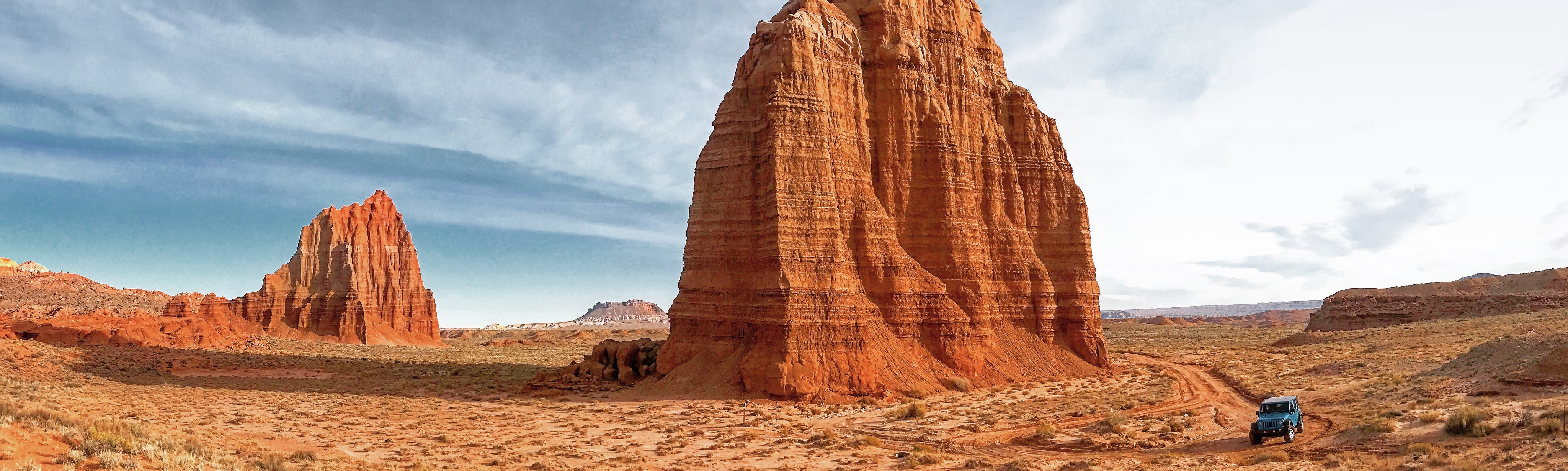 A Jeep drives through Capitol Reef National Park.