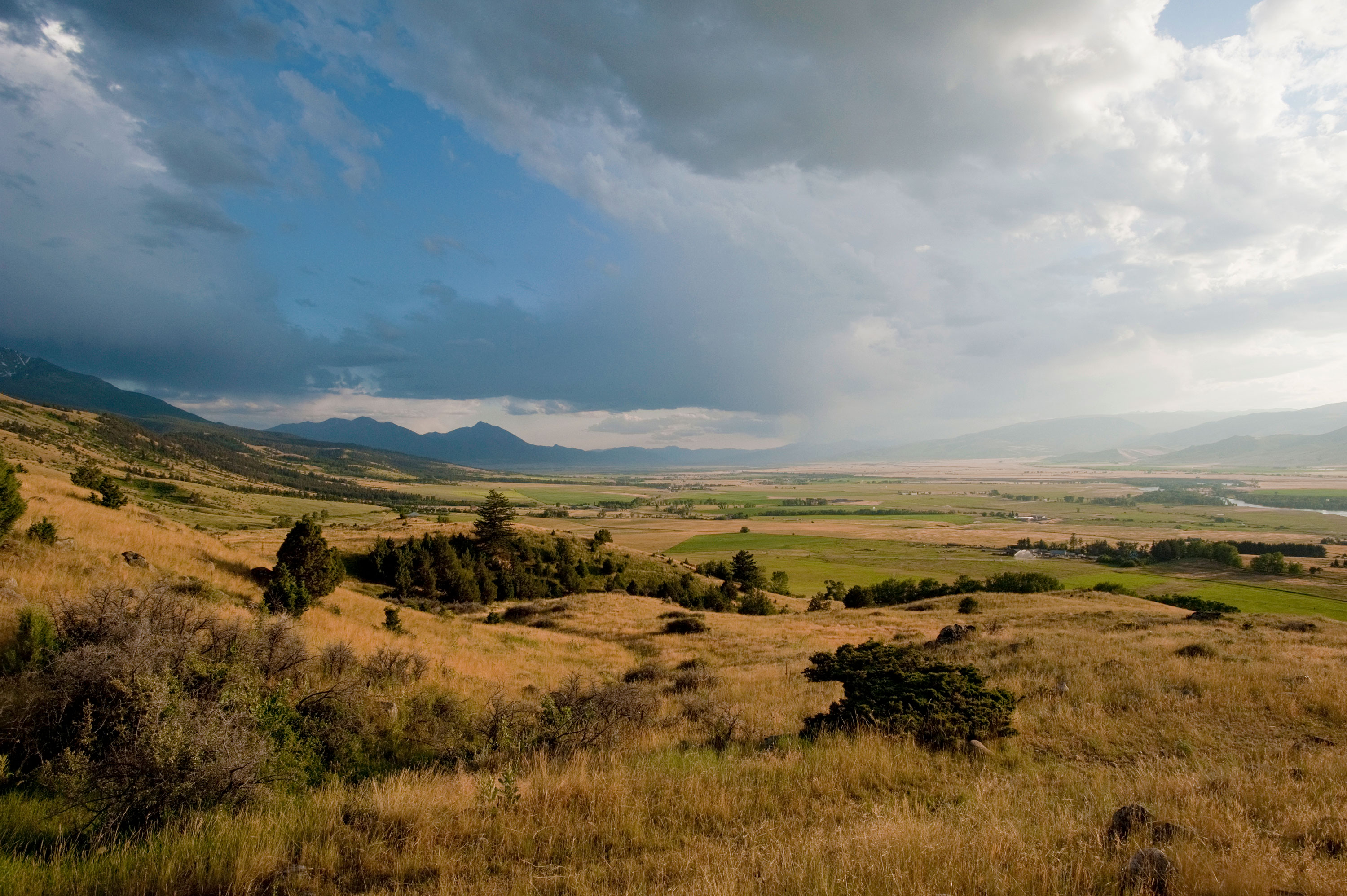 Clouds fill Montana's Paradise Valley, as seen from the road to Pine Creek Falls.