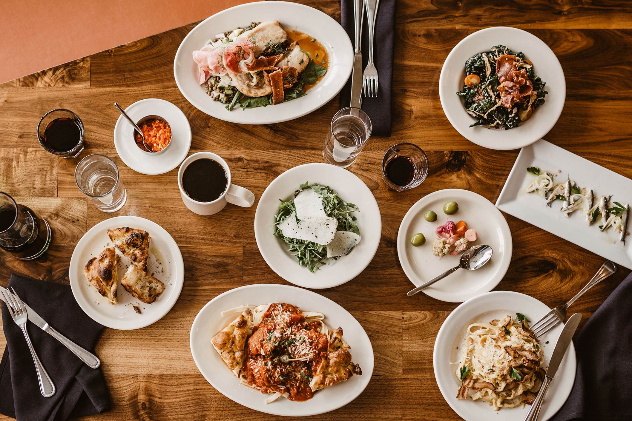 Dinner and drinks on a table at Campione in Livingston, Montana.