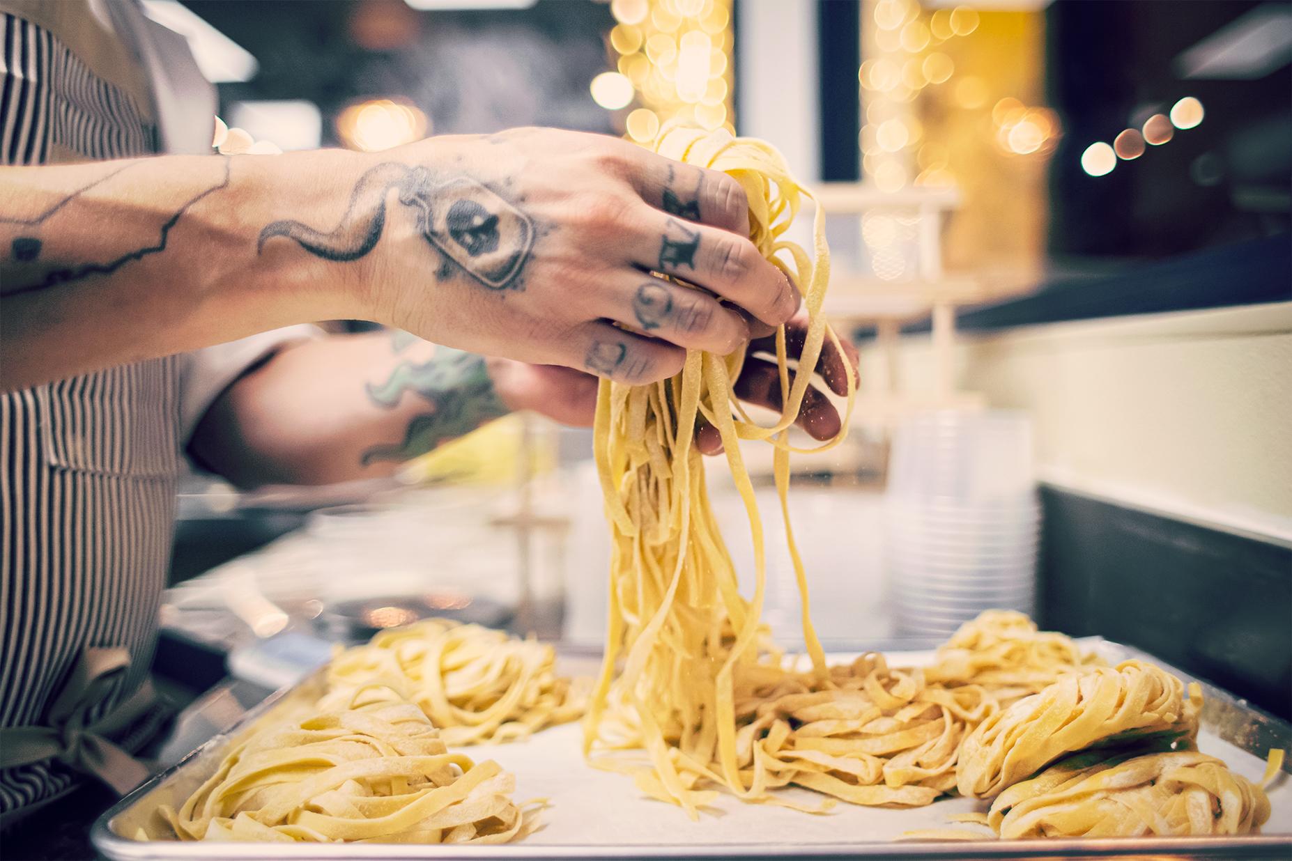 A chef makes pasta at Teatro Pasta in Flagstaff, Arizona.