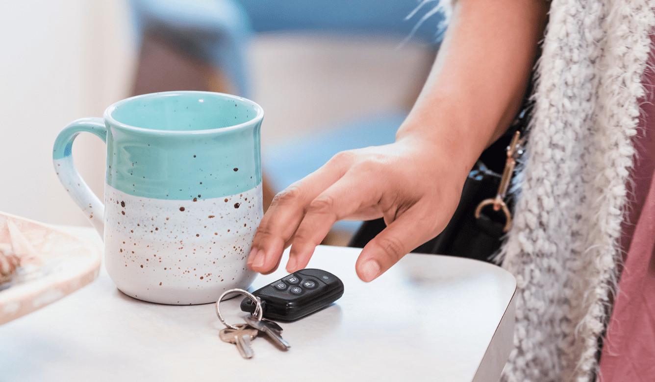 Person reaching for key fob