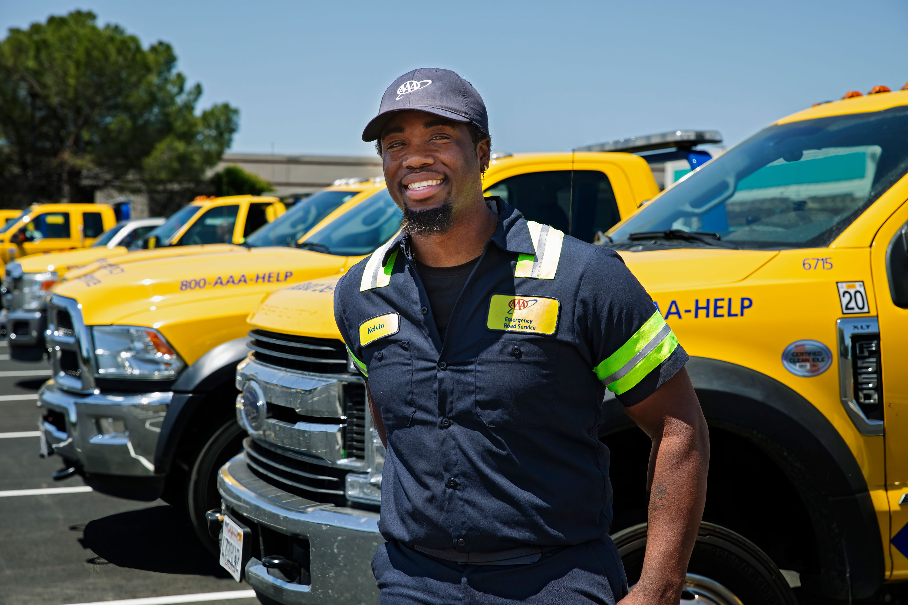 AAA tow truck driver Kevin outside his truck in the AAA parking lot.