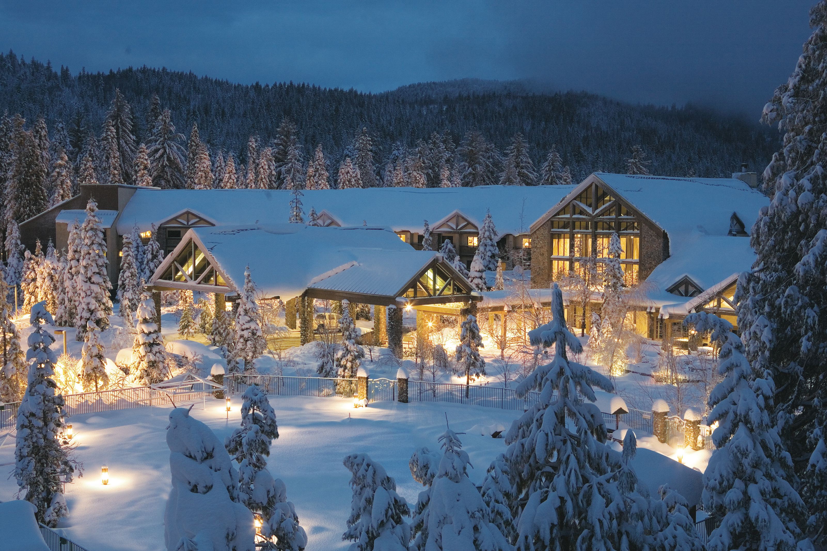 Tenaya at Yosemite covered in snow and lit up at dusk.