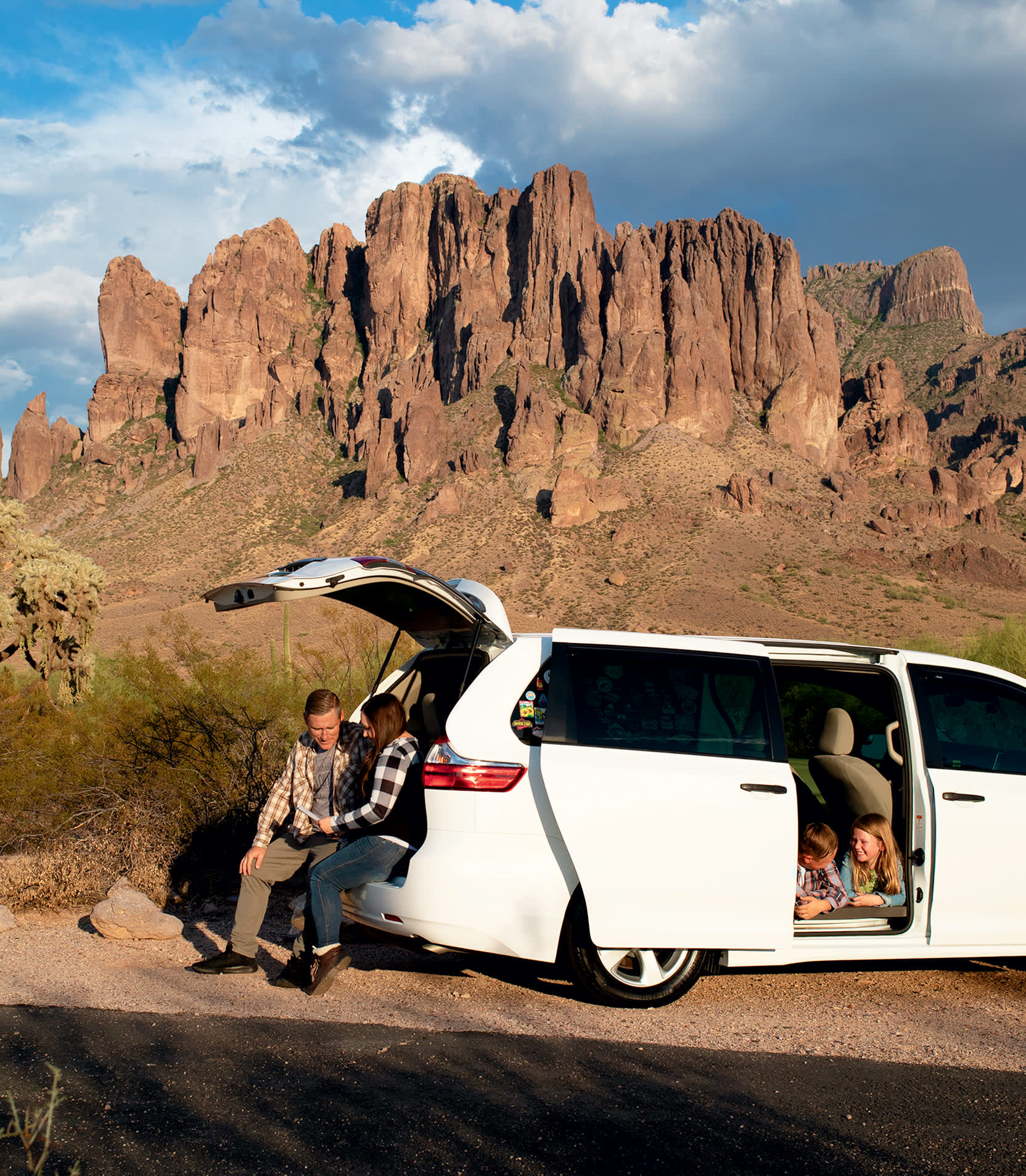 The Boomgardden family sits inside their van.