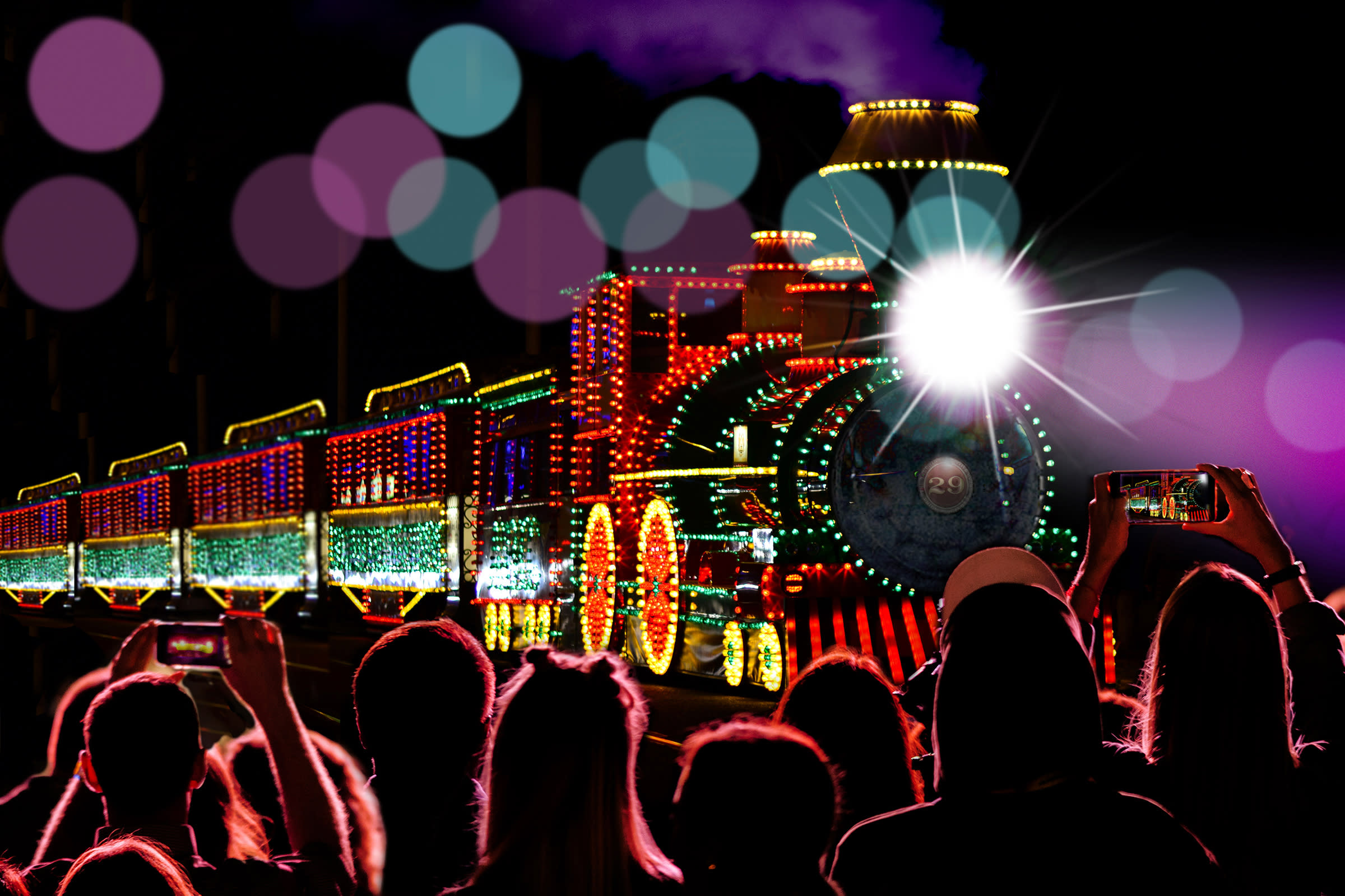 People watch as the train of lights goes by in Virginia City, Nevada.