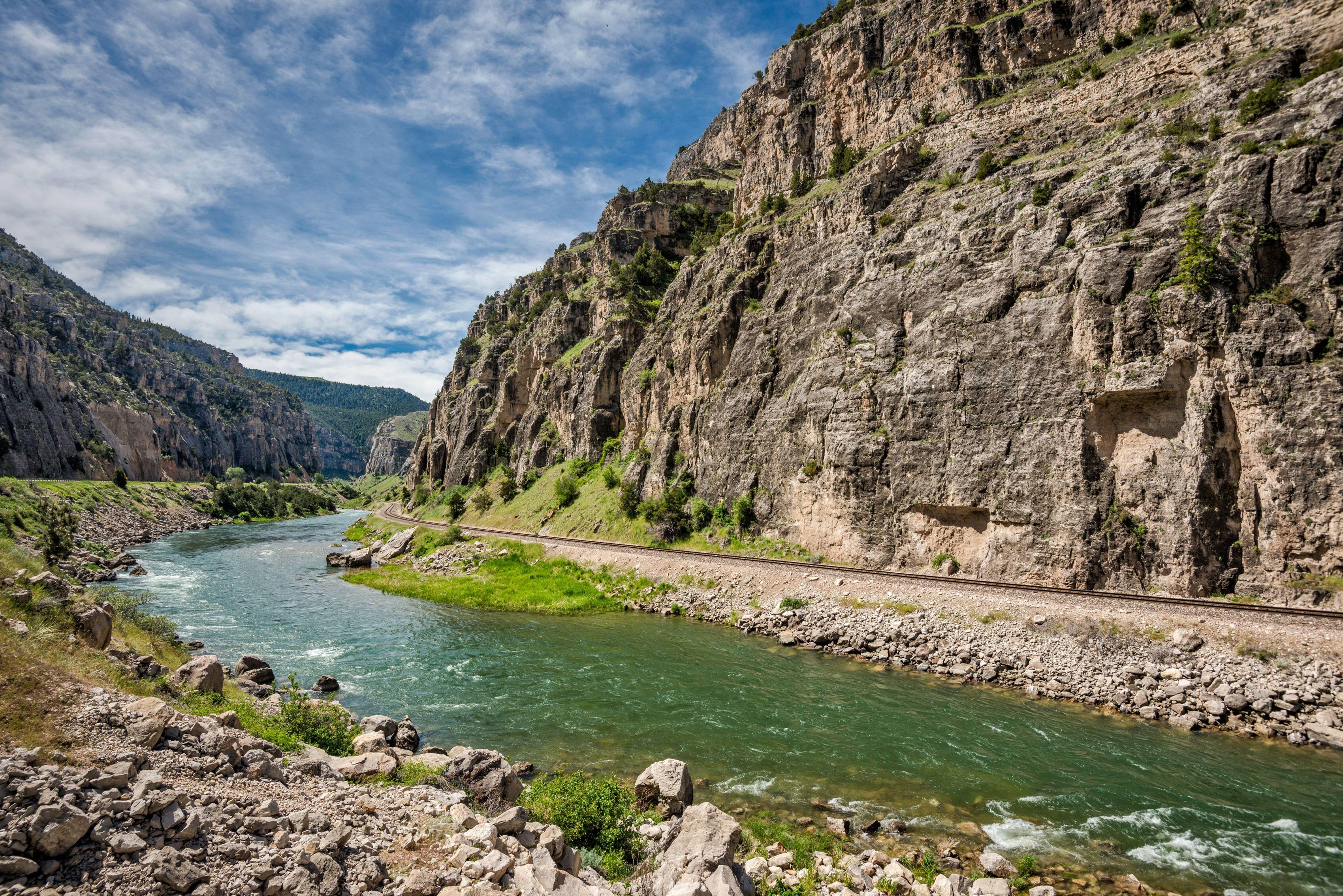 A train track follows Wind River Canyon near Thermopolis, Wyoming.