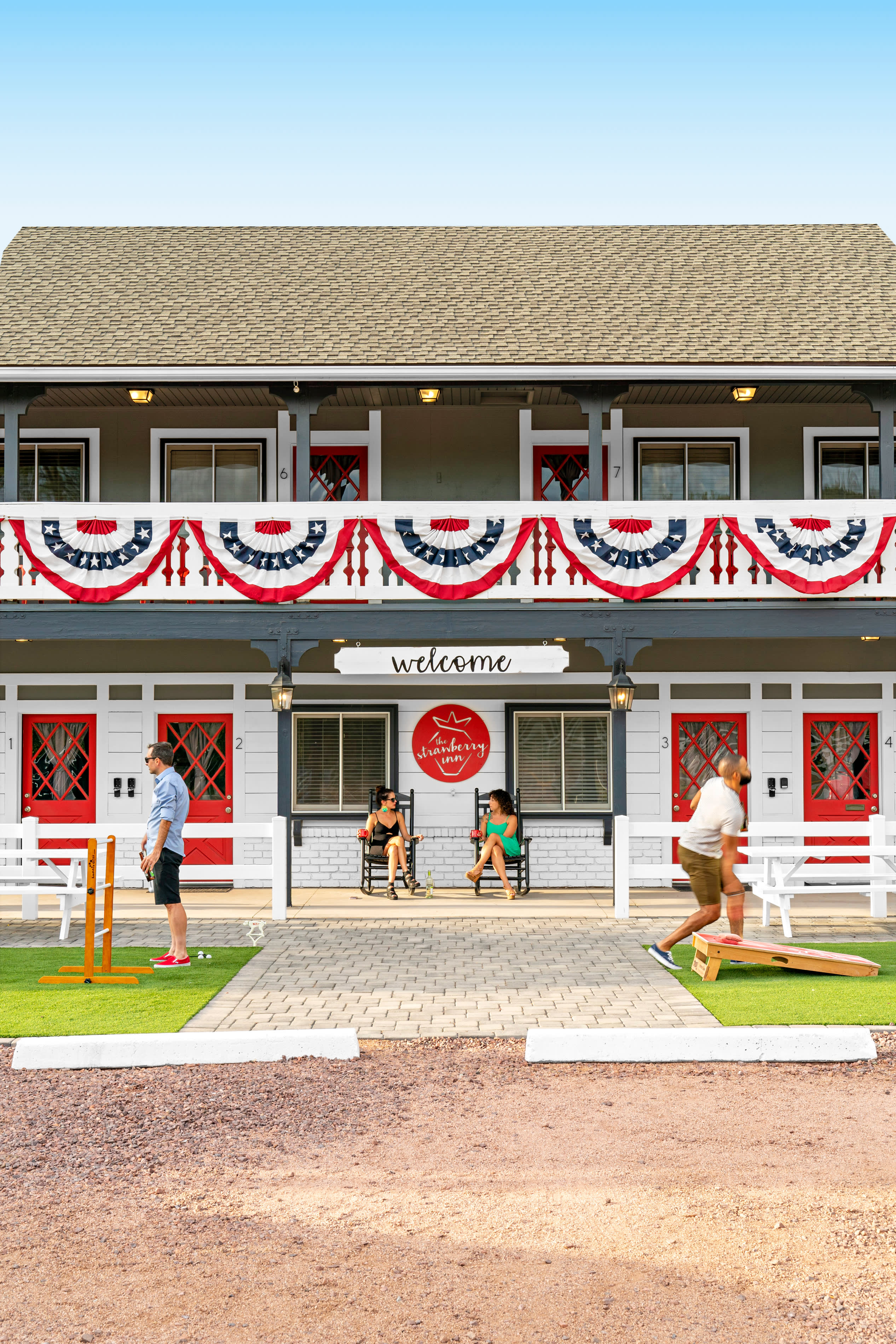 People relax and play lawn games outside of Strawberry Inn in Strawberry, Arizona.