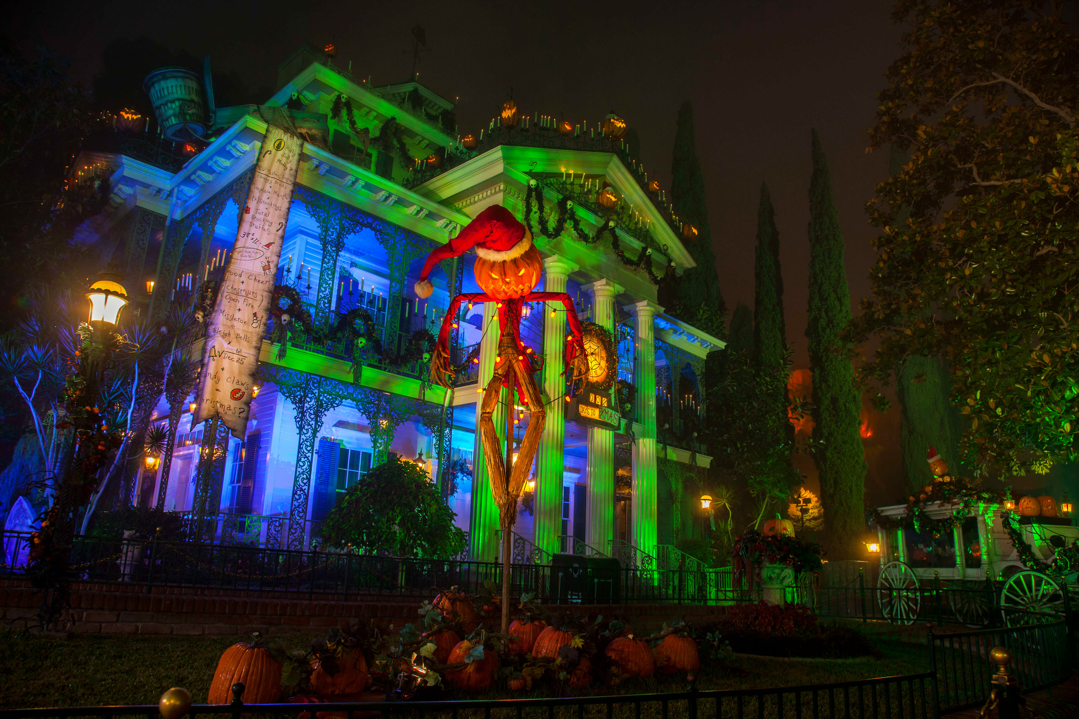 Halloween decorations outside of the Haunted Mansion Holiday in Disneyland Park.