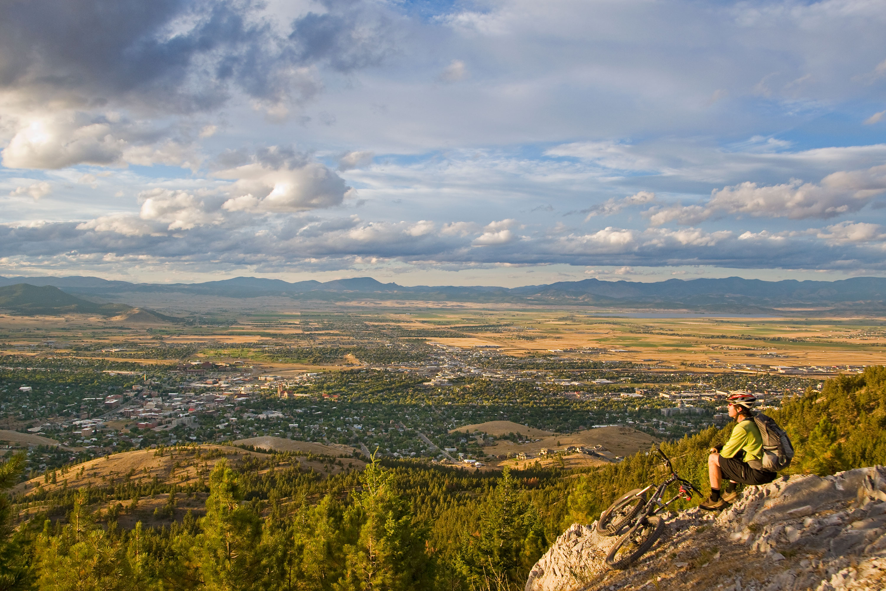 A mountain biker rests on a trail on the South Hills area of Helena, Montana.