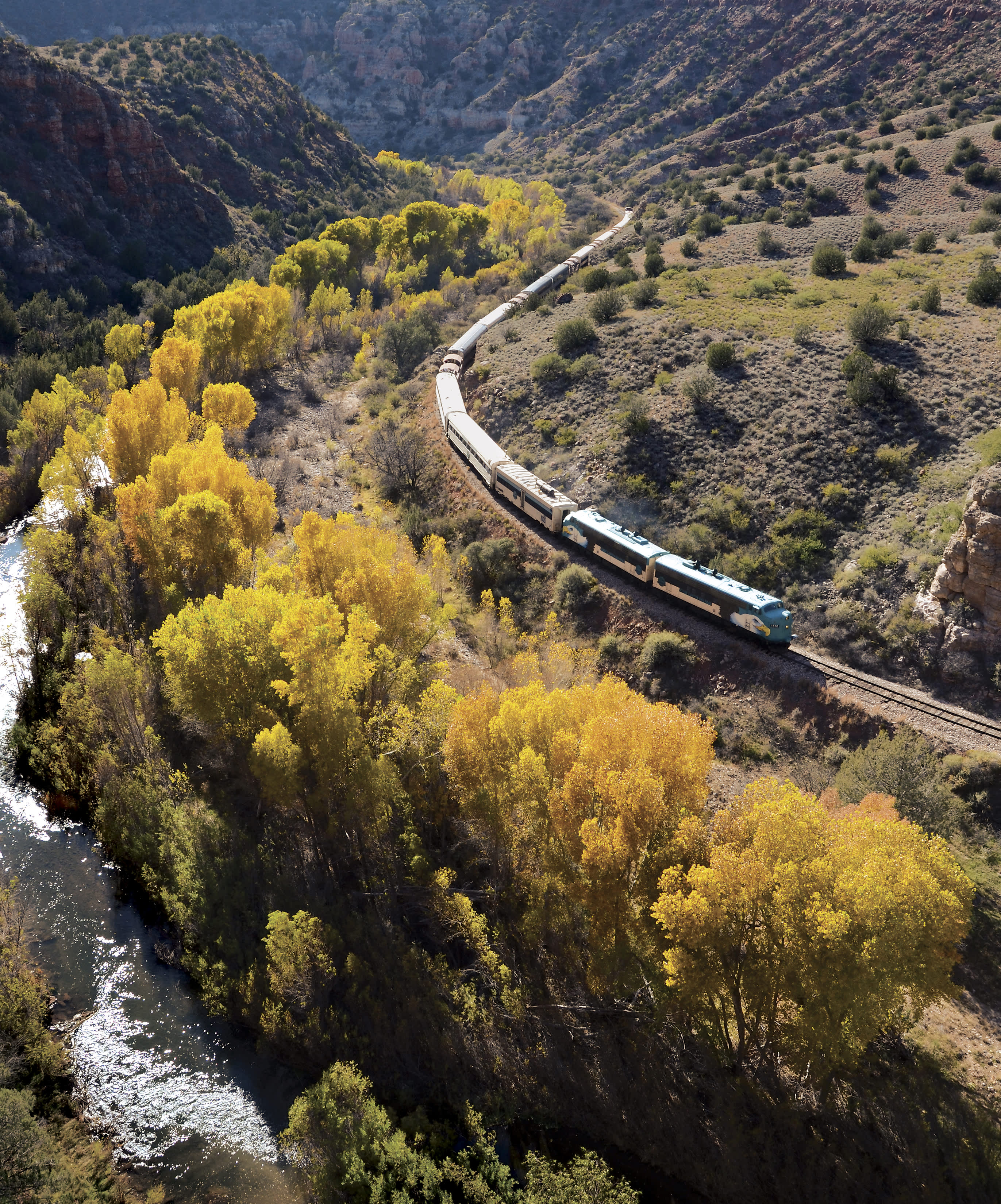 A Verde Canyon Railroad travels past fall color.